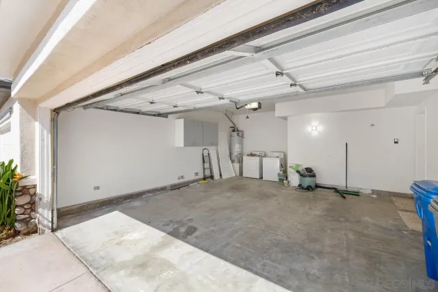 a view of a house with a yard and garage