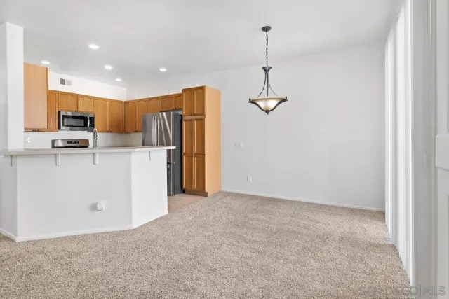 a view of a kitchen with a sink and dishwasher