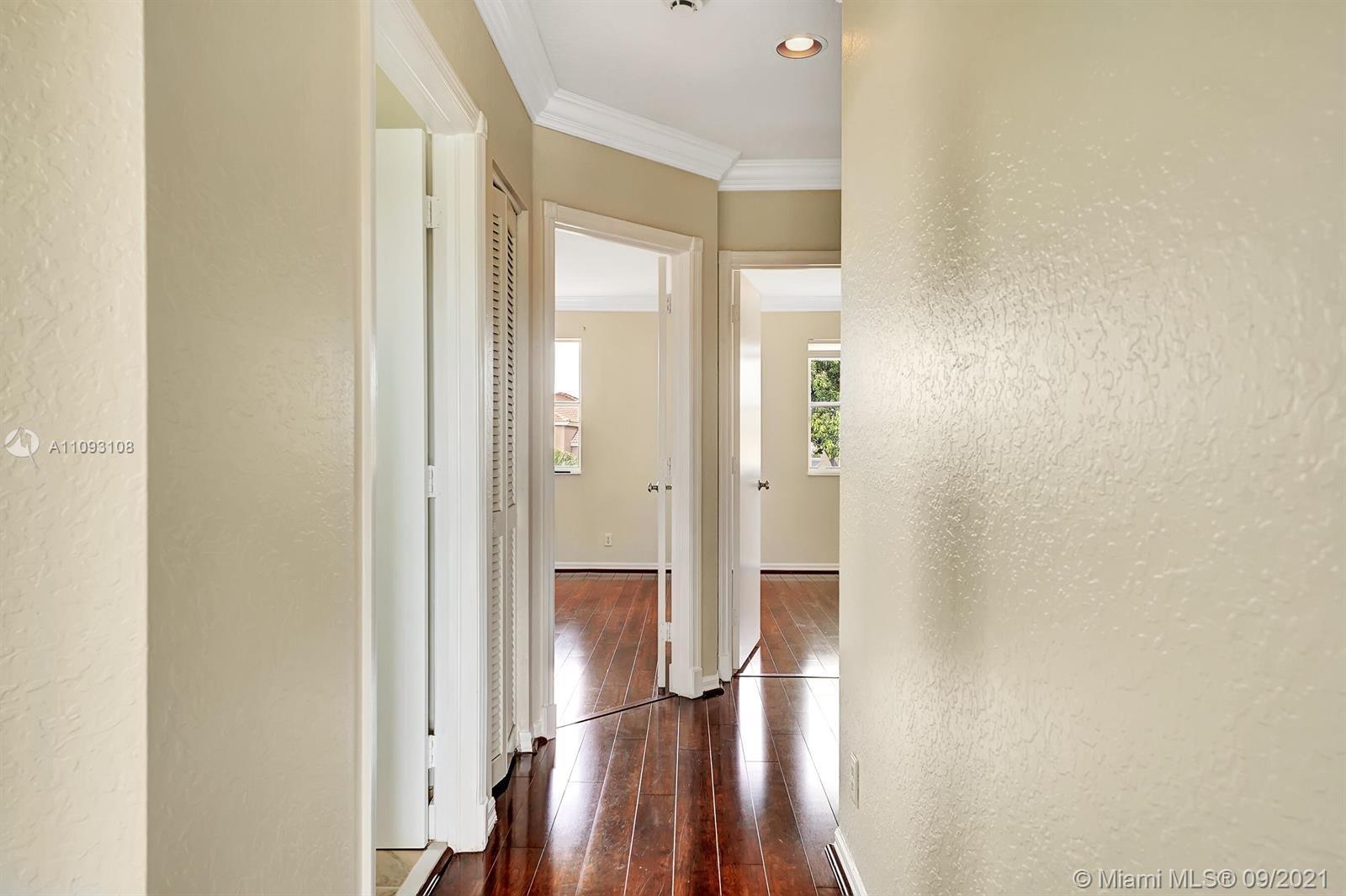 18672 Sea Turtle Lane Boca Raton, FL 33498 - Photo 14 of 44 a bathroom with a glass shower door