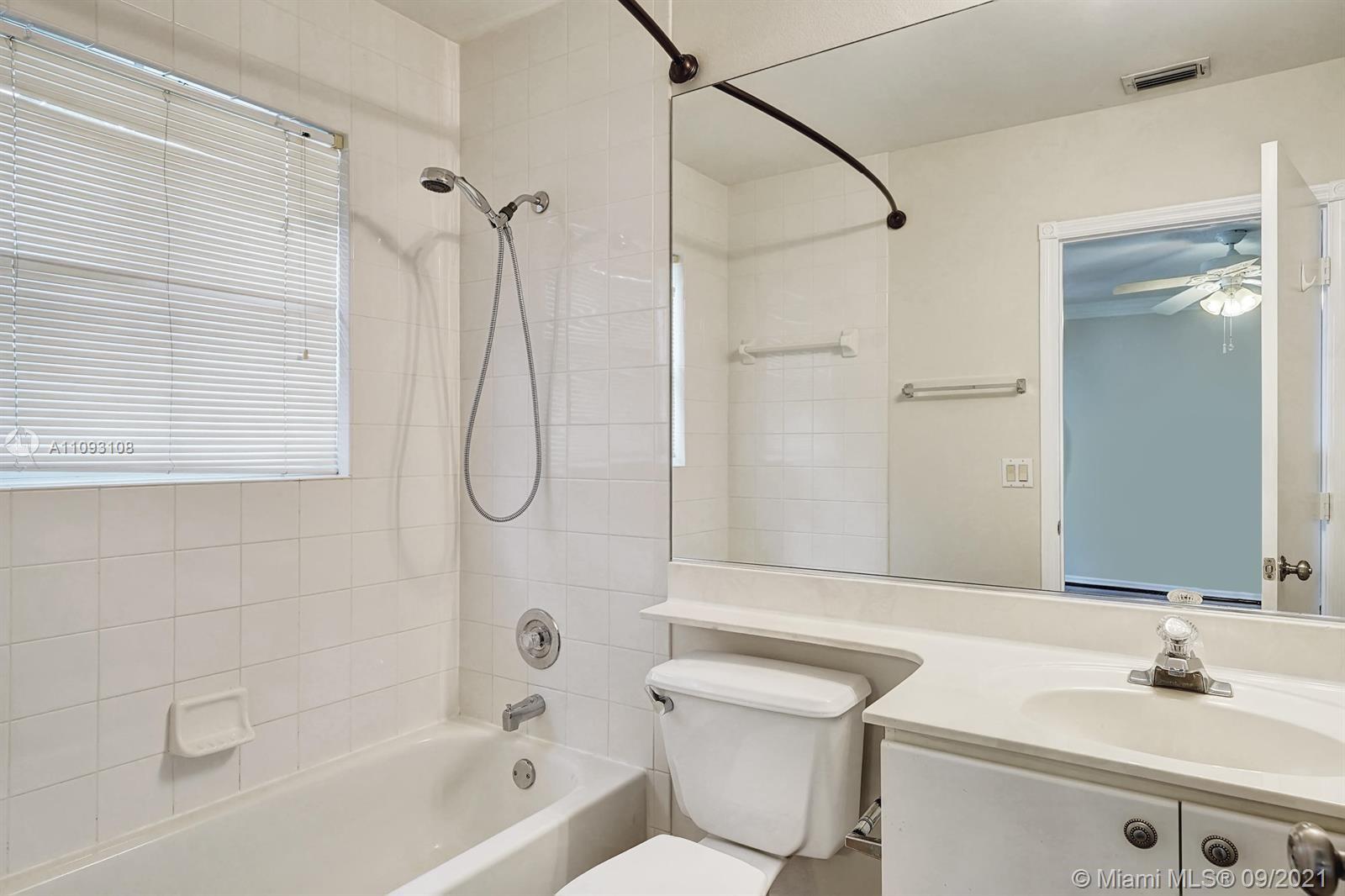 18672 Sea Turtle Lane Boca Raton, FL 33498 - Photo 28 of 44 a bathroom with a sink toilet and shower