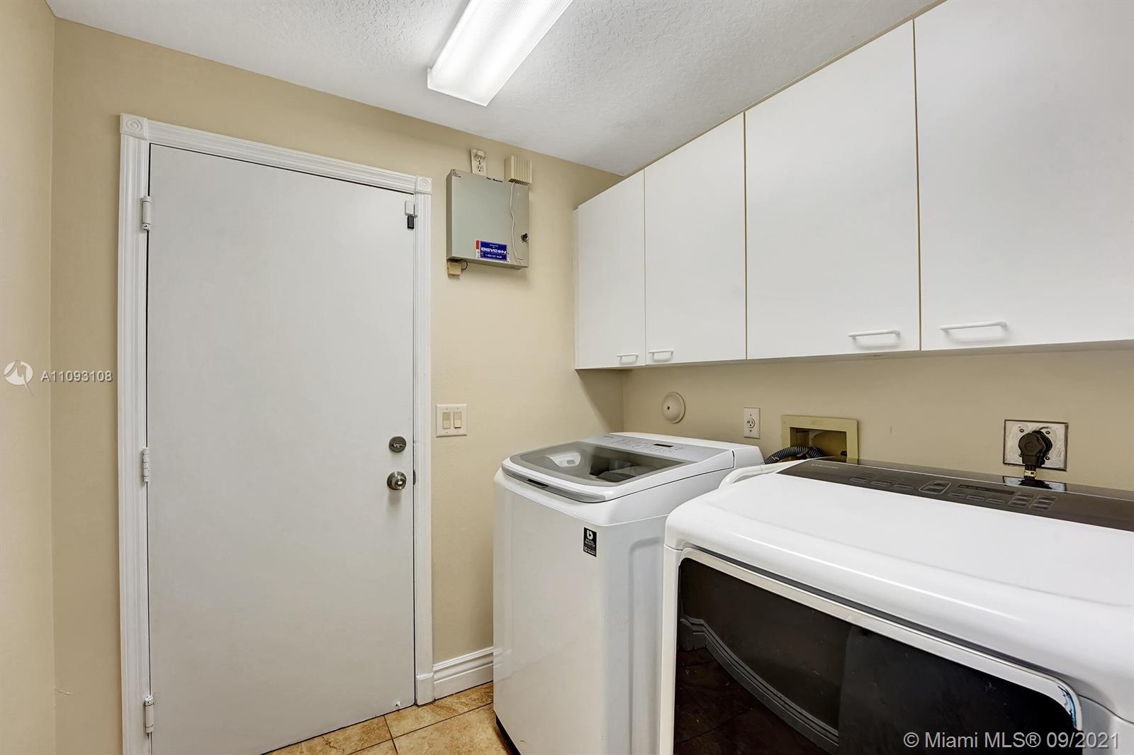 18672 Sea Turtle Lane Boca Raton, FL 33498 - Photo 30 of 44 a utility room with dryer and washer