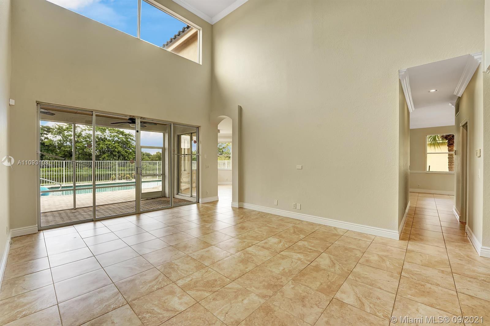 18672 Sea Turtle Lane Boca Raton, FL 33498 - Photo 4 of 44 a view of an entryway with wooden floor