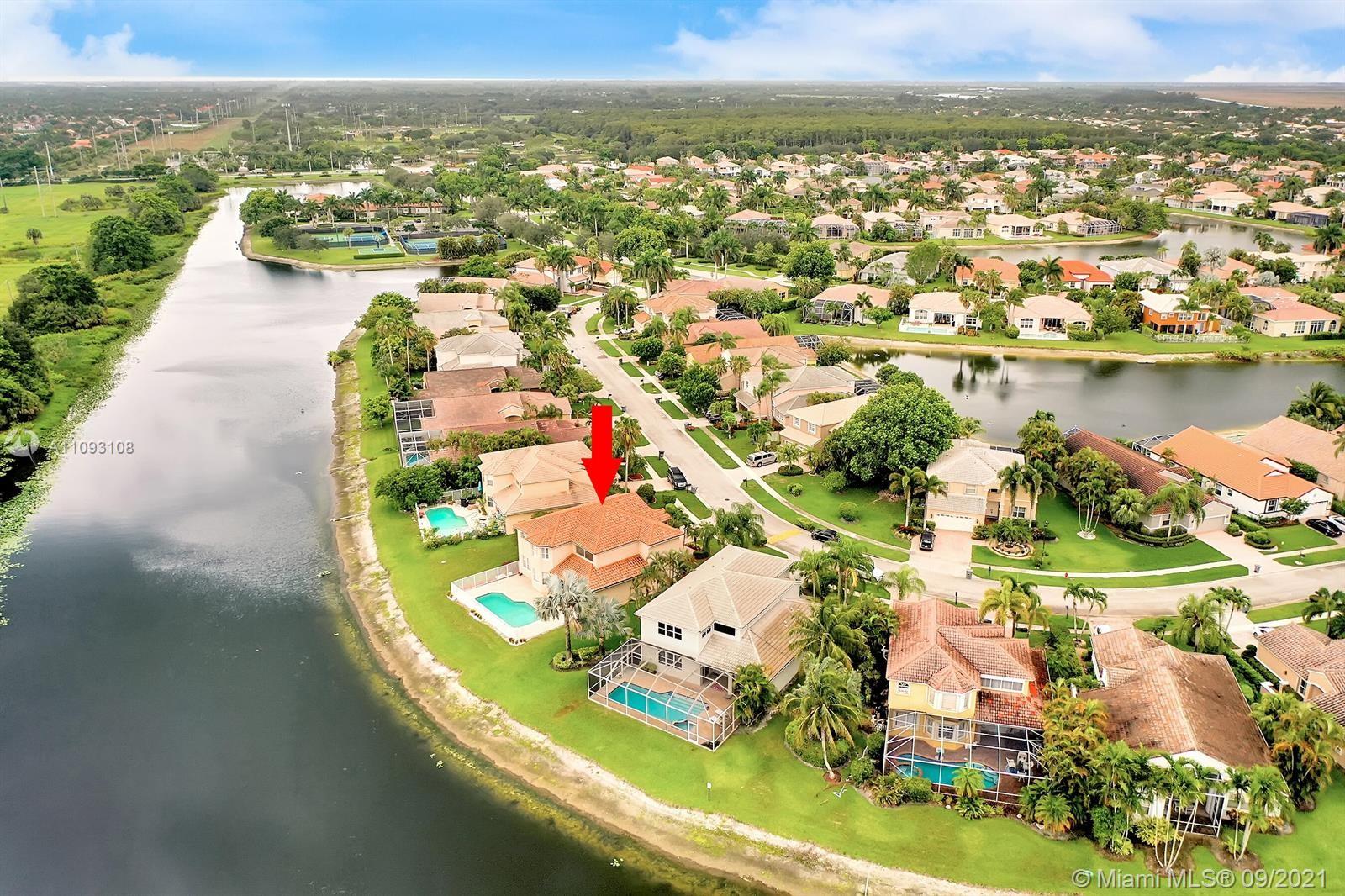18672 Sea Turtle Lane Boca Raton, FL 33498 - Photo 40 of 44 an aerial view of residential houses with outdoor space and lake view