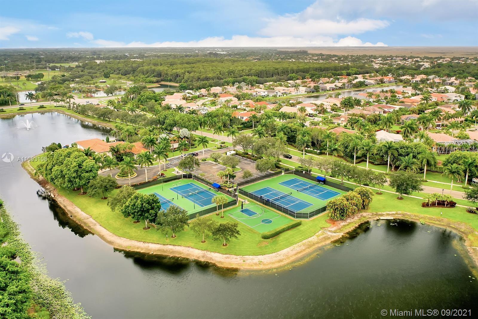 18672 Sea Turtle Lane Boca Raton, FL 33498 - Photo 41 of 44 an aerial view of residential houses with outdoor space and lake view