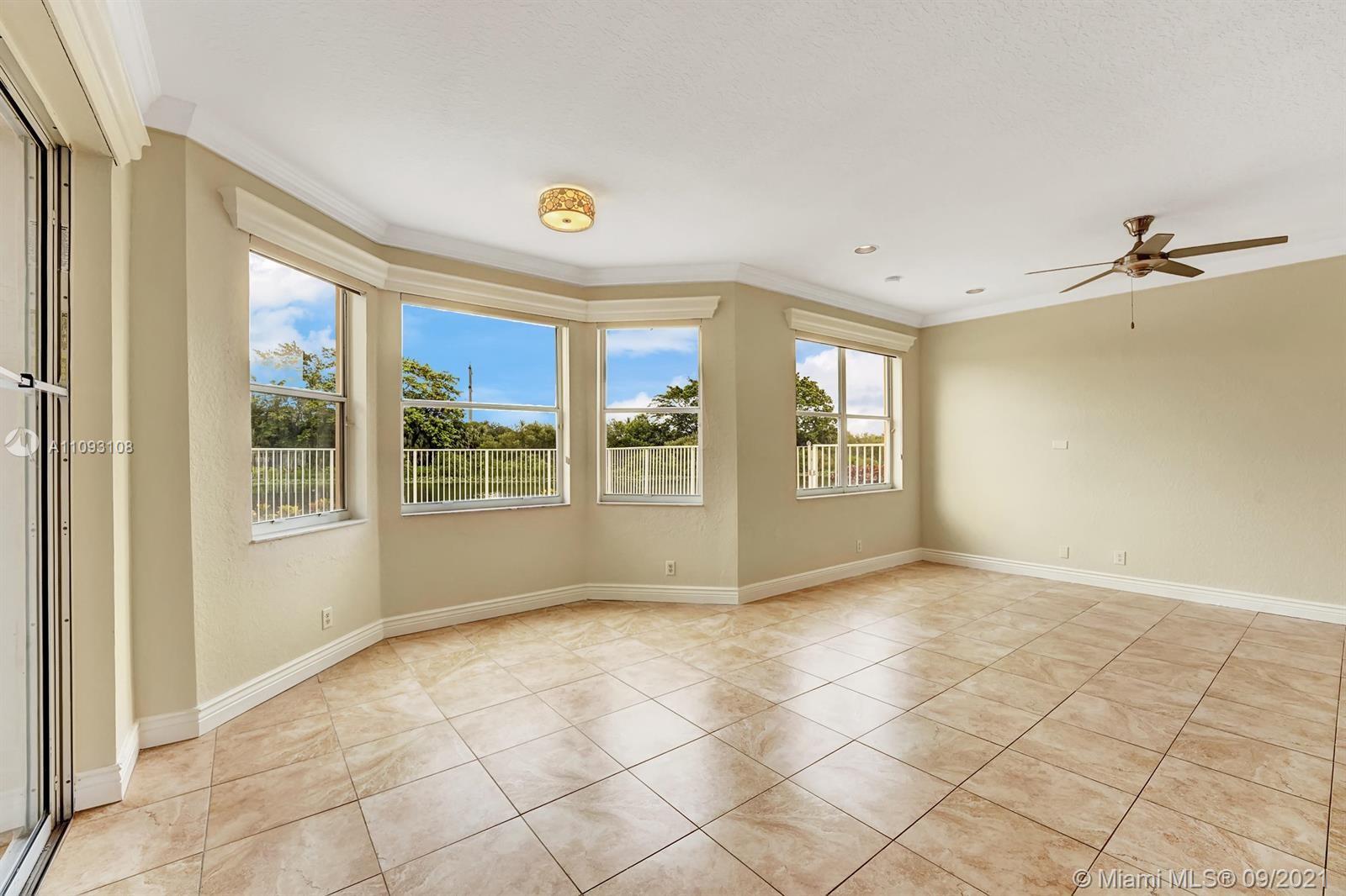 18672 Sea Turtle Lane Boca Raton, FL 33498 - Photo 6 of 44 a view of an empty room with a window