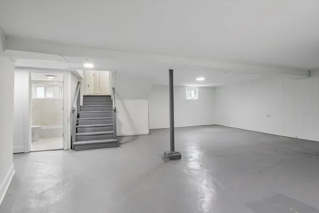 a view of an empty room with stairs
