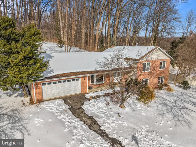 a front view of a house with yard and garage