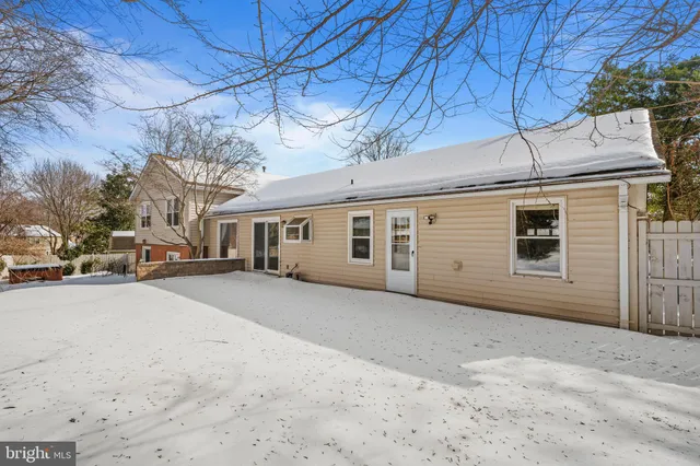 a view of a house with a snow in the yard