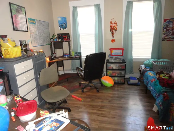 a room with furniture and gym equipment