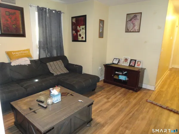 a living room with furniture and window