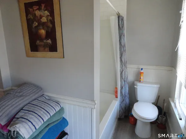 a white toilet sitting next to a bathroom sink