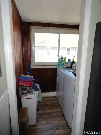 a room with water heater and a window