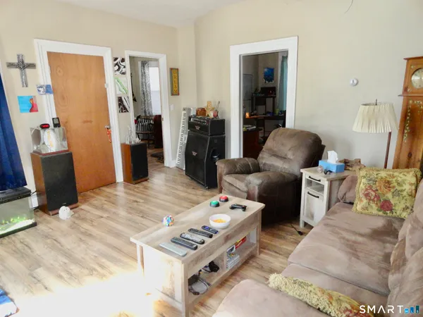 a living room with furniture and a table