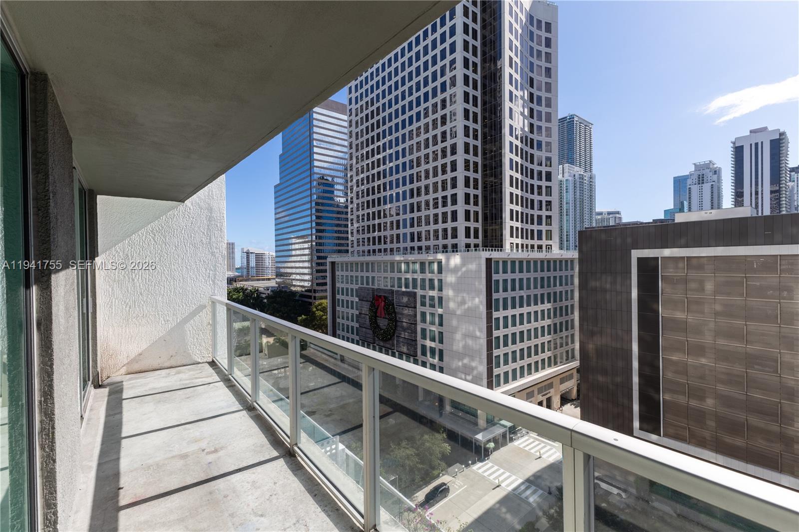 55 Southeast 6th Street, Unit 1202 Miami, FL 33131 - Photo 15 of 45 a balcony with a street
