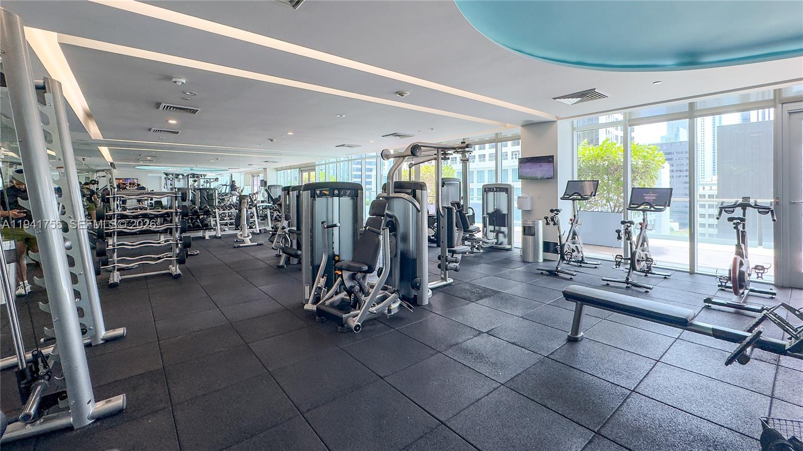 55 Southeast 6th Street, Unit 1202 Miami, FL 33131 - Photo 31 of 45 a view of a room with gym equipment
