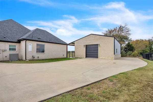 an aerial view of a house with outdoor space