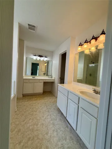 a bathroom with a sink and mirror
