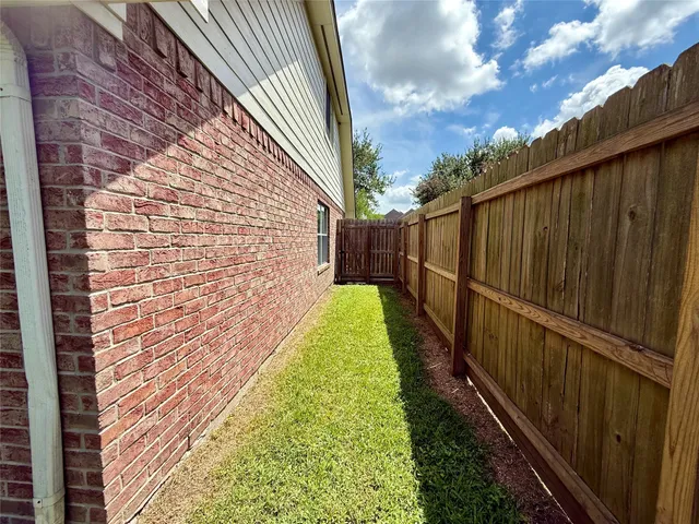 a view of a pathway with a backyard