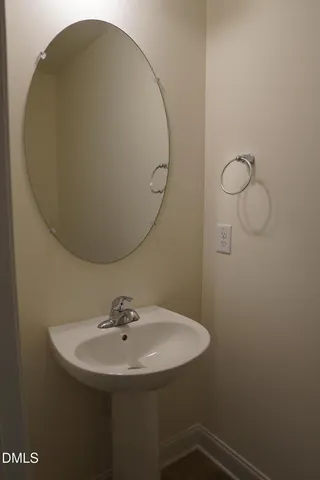a bathroom with a sink and mirror