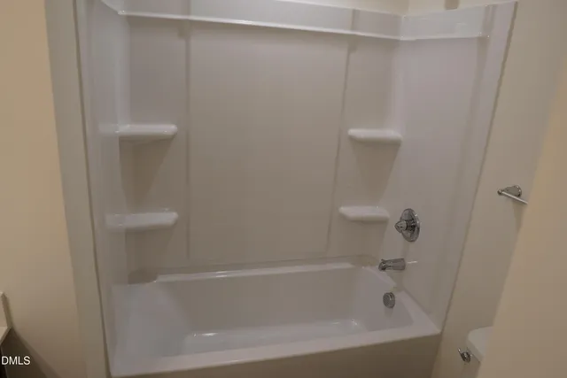 a close view of a bathtub in bathroom