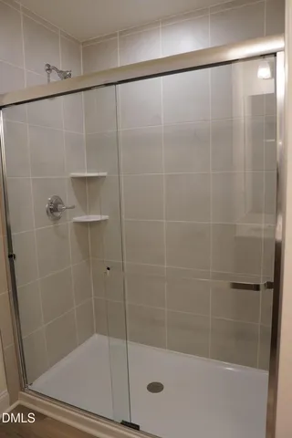 a bathroom with a shower and a toilet
