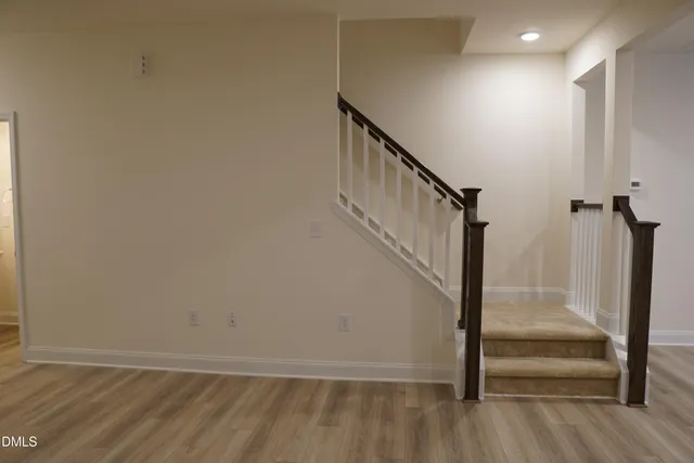 a view of entryway with wooden floor