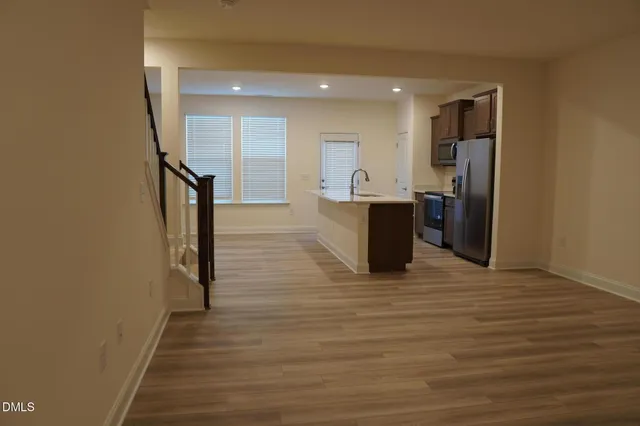 a view of a living room with wooden floor