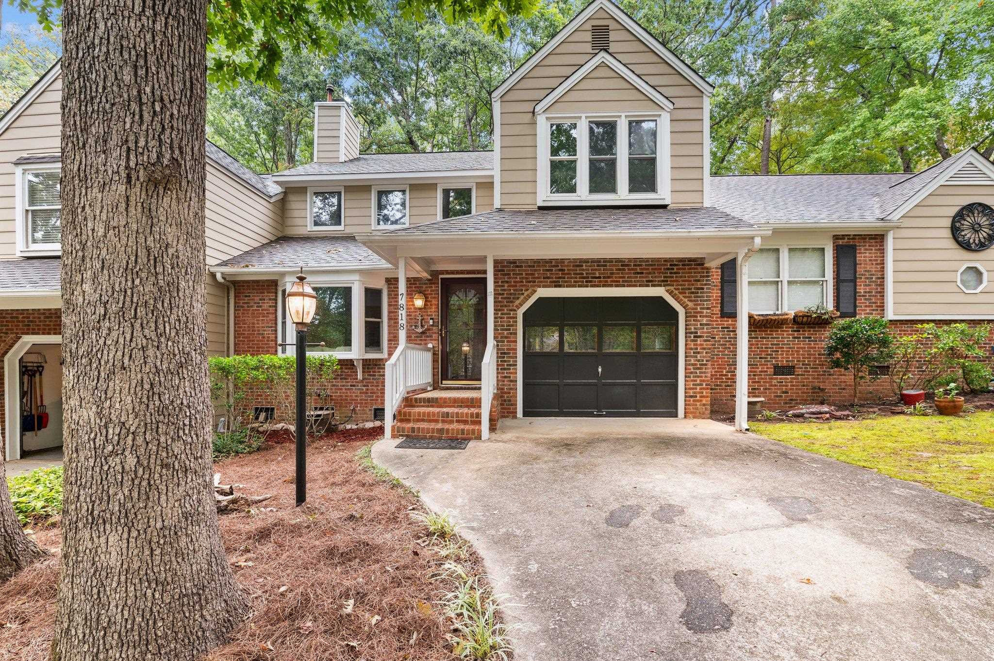 7818 Breckon Way Raleigh, NC 27615 - Photo 1 of 27 a front view of a house with garden
