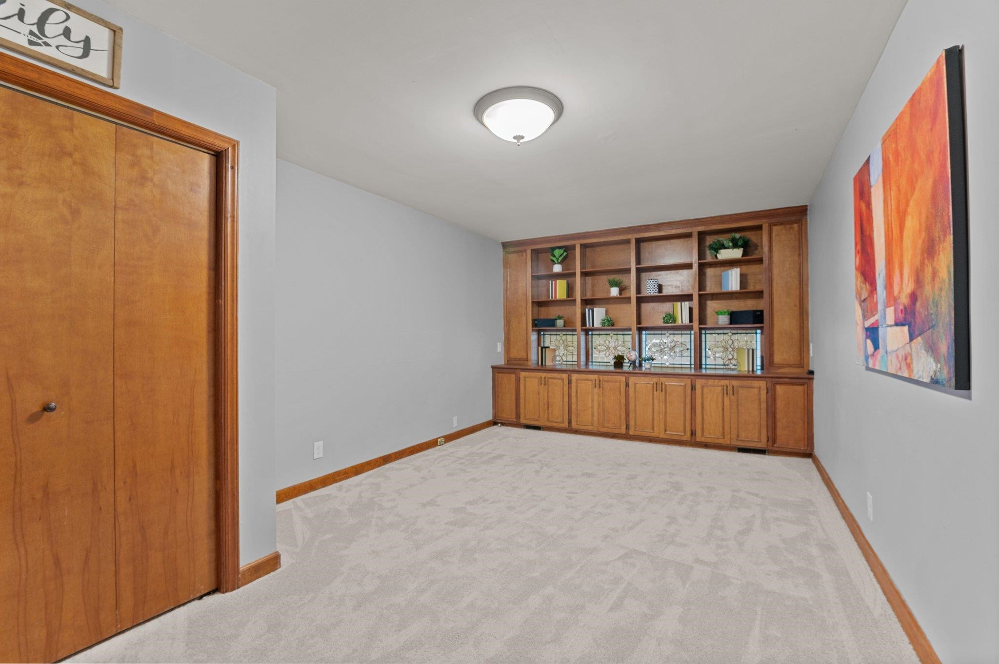 7818 Breckon Way Raleigh, NC 27615 - Photo 13 of 27 a view of an empty room with window and cabinet