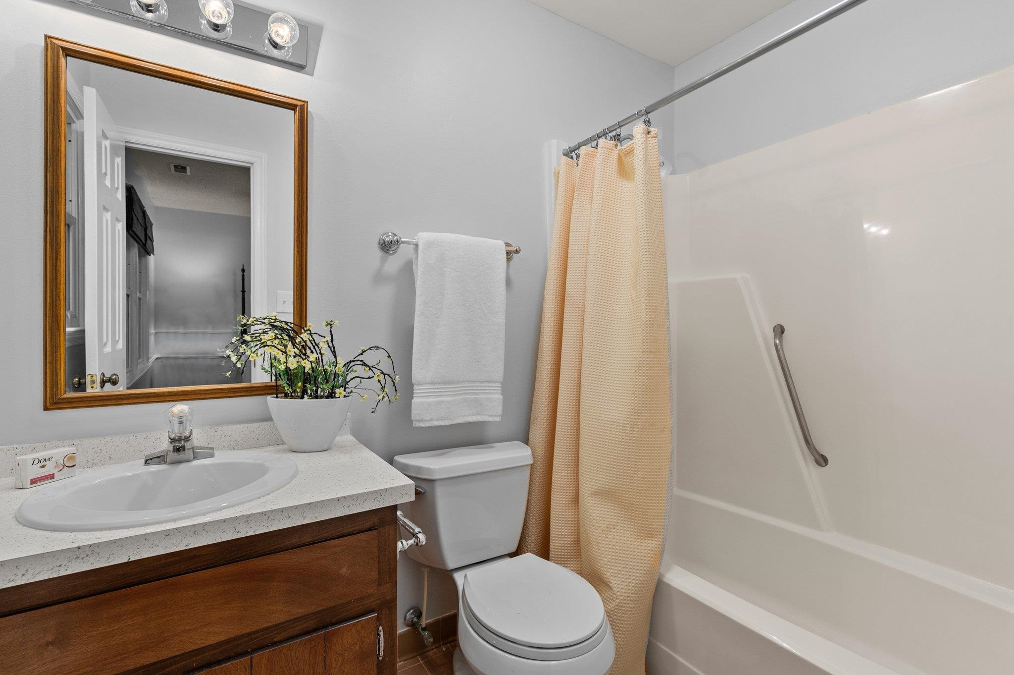 7818 Breckon Way Raleigh, NC 27615 - Photo 18 of 27 a bathroom with a sink toilet and shower