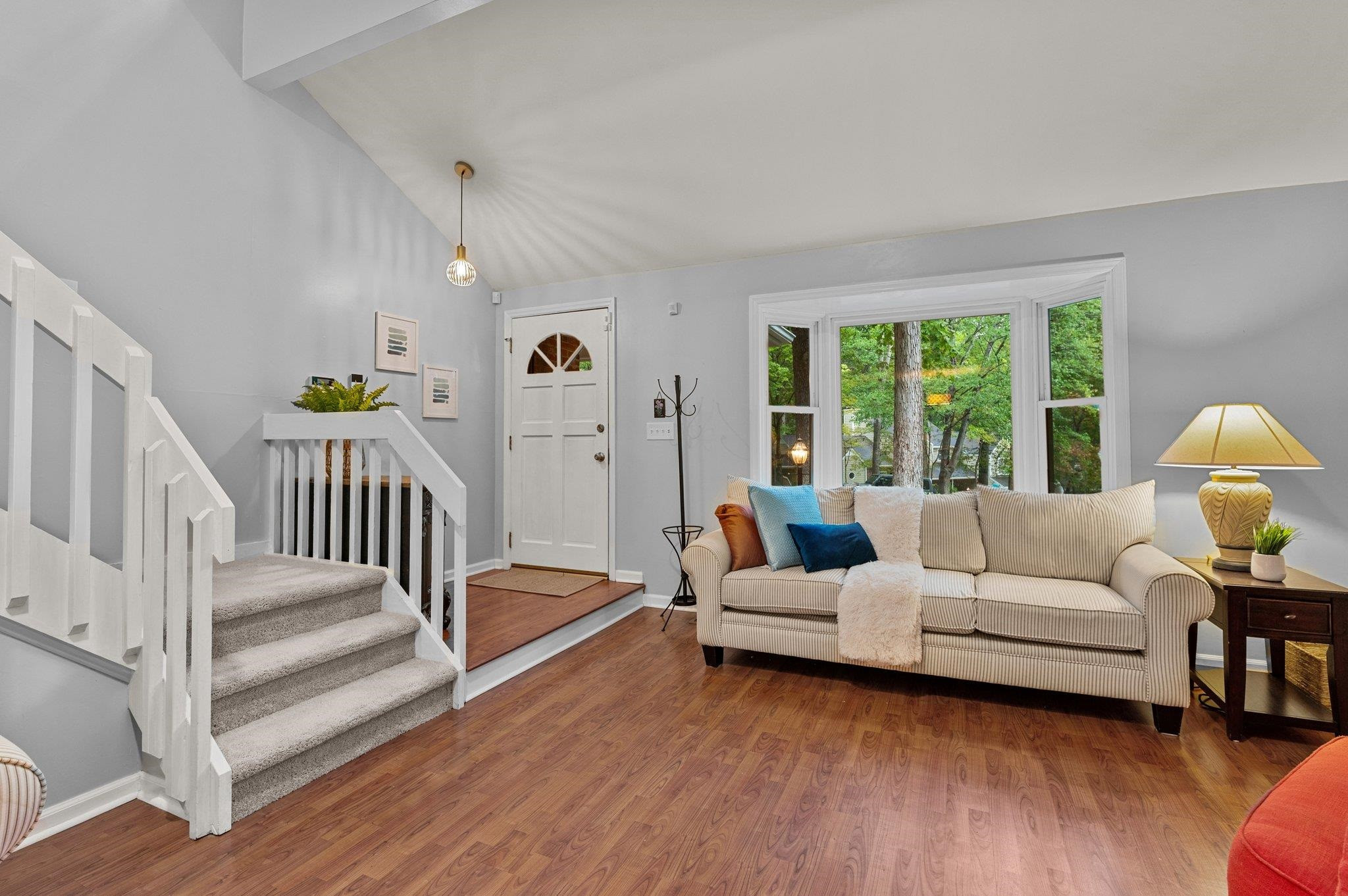 7818 Breckon Way Raleigh, NC 27615 - Photo 4 of 27 a living room with furniture and a wooden floor