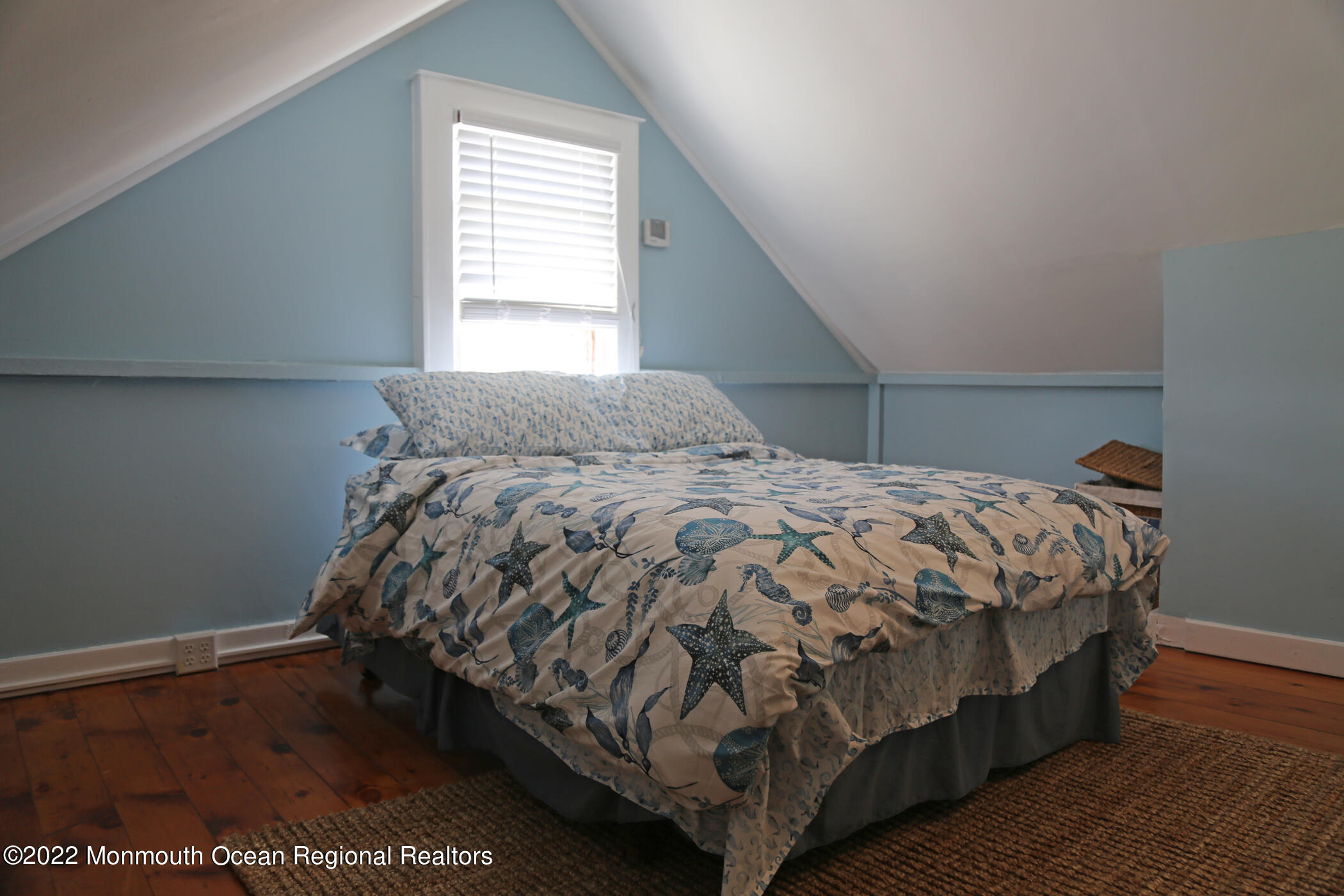 87 Cookman Avenue Ocean Grove, NJ 07756 - Photo 12 of 19 a bed sitting in a bedroom next to a window