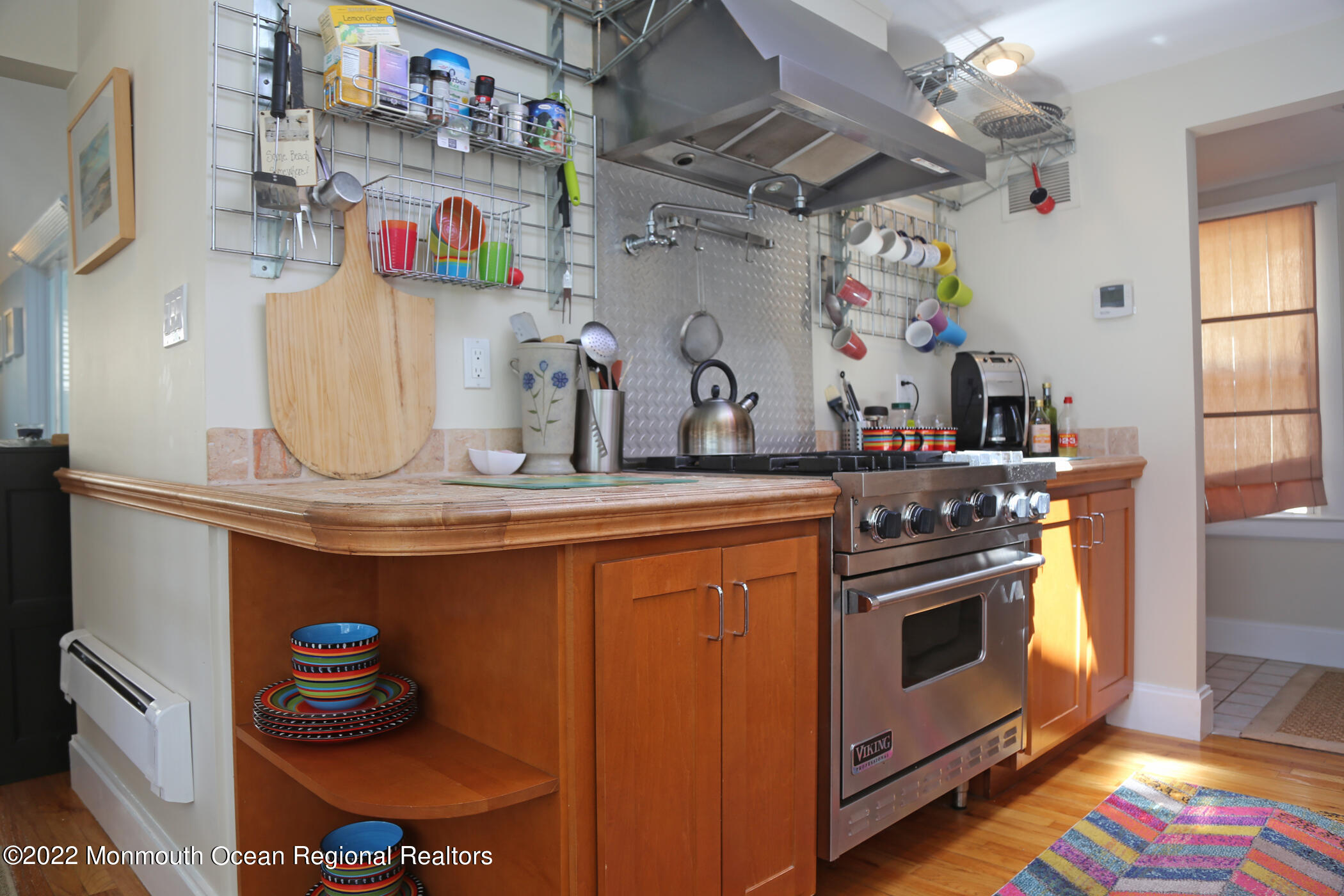 87 Cookman Avenue Ocean Grove, NJ 07756 - Photo 13 of 19 a kitchen with granite countertop lots of clutter and stainless steel appliances
