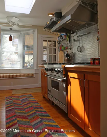 a kitchen with a stove and a microwave
