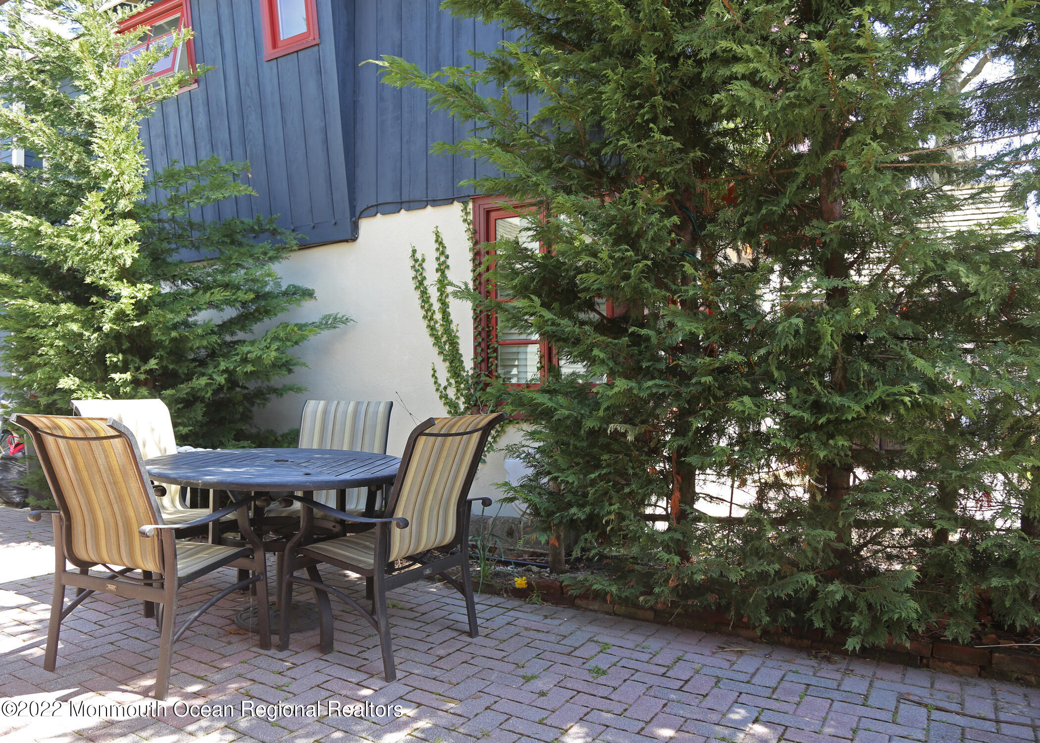 87 Cookman Avenue Ocean Grove, NJ 07756 - Photo 16 of 19 a view of a chairs and table in the backyard