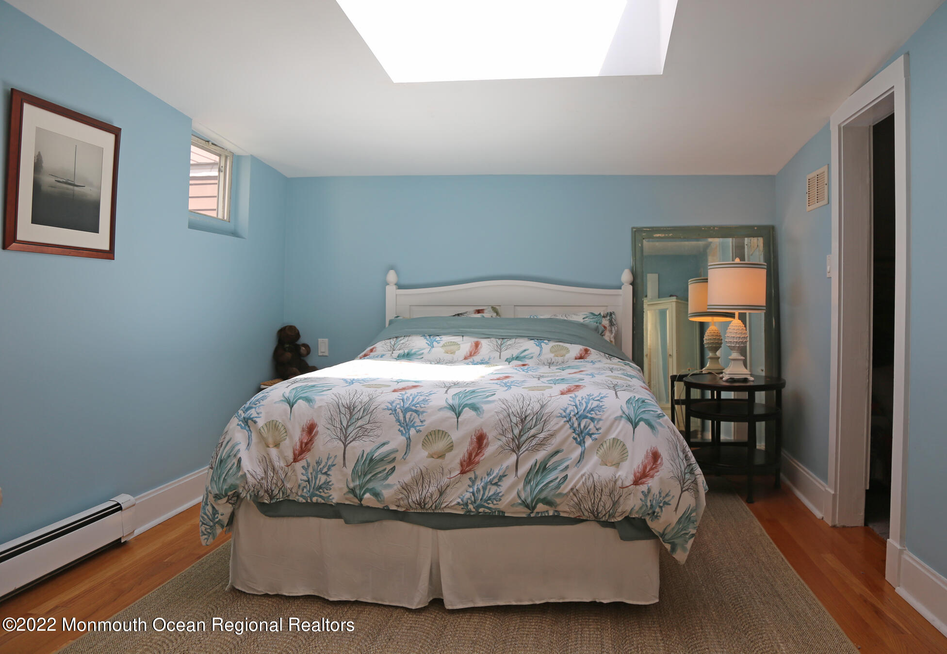 87 Cookman Avenue Ocean Grove, NJ 07756 - Photo 10 of 19 a large bed sitting in a bedroom next to a window