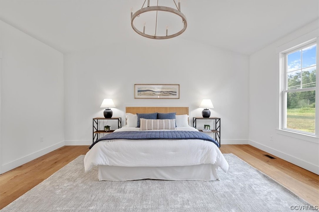 3652 West Rocketts Rdg Court Goochland, VA 23063 - Photo 24 of 50 a spacious bedroom with a bed and a window