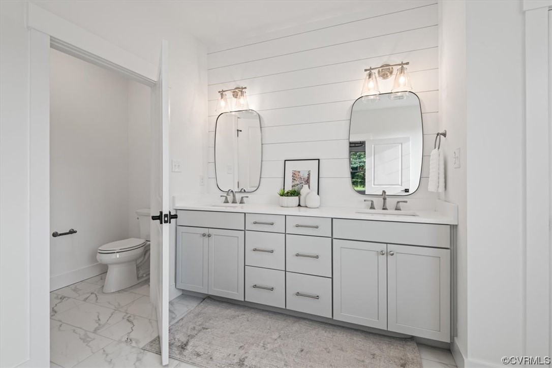 3652 West Rocketts Rdg Court Goochland, VA 23063 - Photo 26 of 50 a spacious bathroom with double vanity a toilet a sink and a mirror