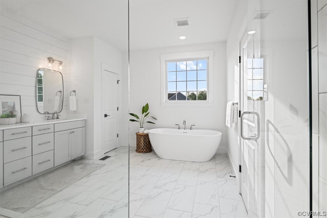 3652 West Rocketts Rdg Court Goochland, VA 23063 - Photo 28 of 50 a spacious bathroom with a tub sink and mirror