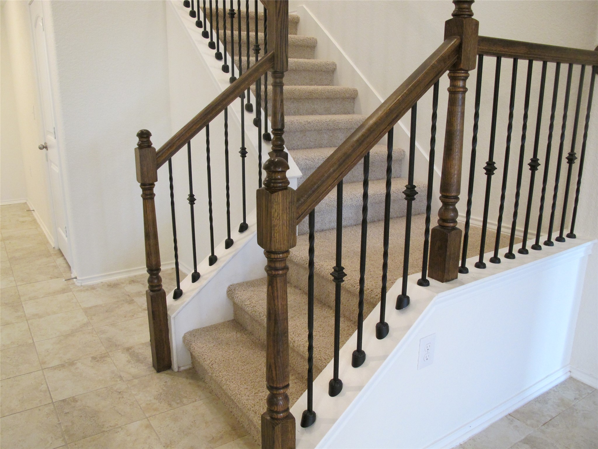 7820 Big Wind Way Austin, TX 78724 - Photo 25 of 37 a view of staircase with railing and white walls