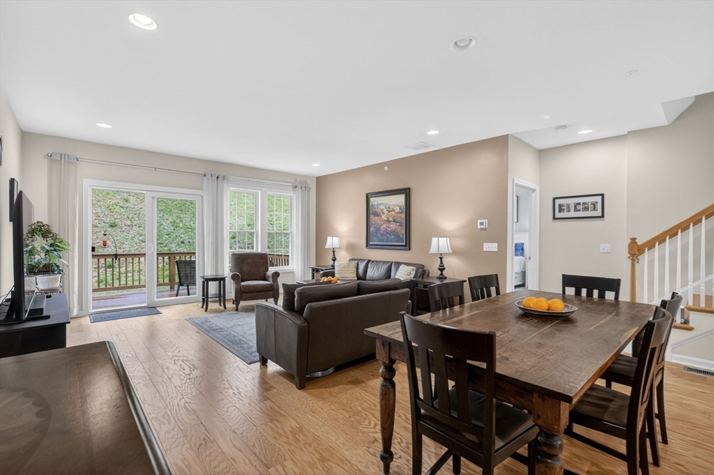 87 Shannon Way, Unit 86 Upton, MA 01568 - Photo 7 of 36 a living room with furniture and a flat screen tv