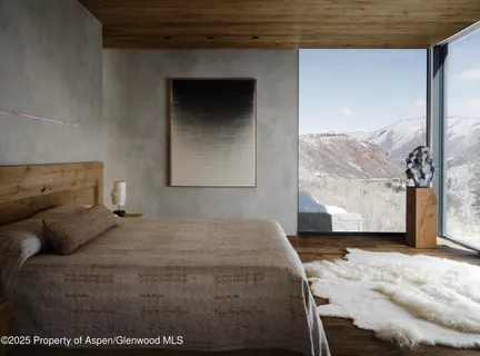 a bedroom with a bed and a large window