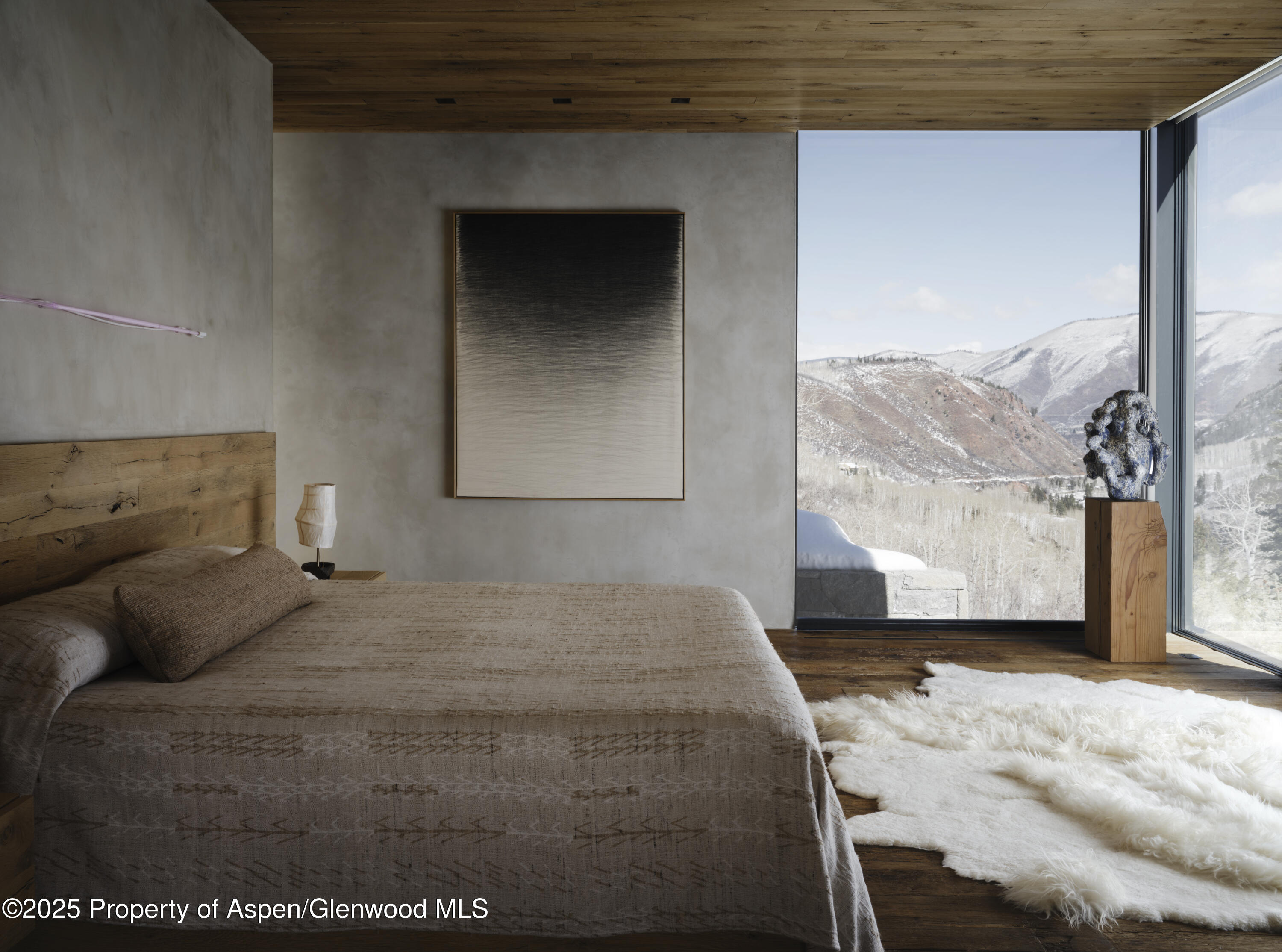 724 North Hayden Road Aspen, CO 81611 - Photo 8 of 35 a bedroom with a bed and a large window