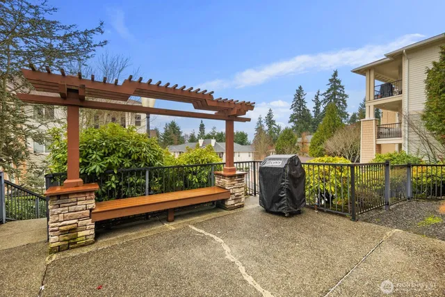 a view of a chair and table in the backyard