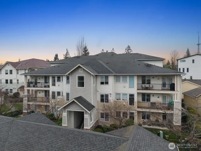 a front view of a house with wooden fence