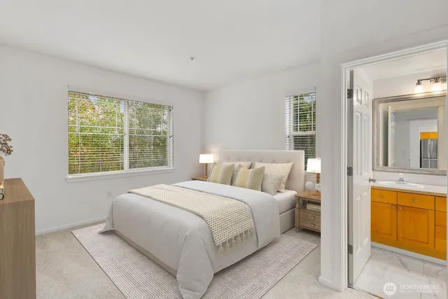 a bedroom with a bed and a sink