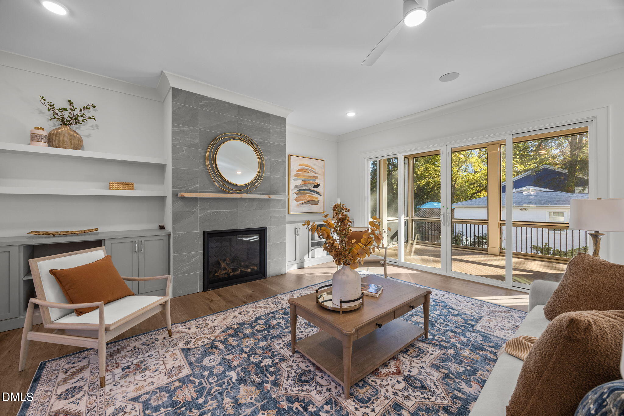 1000 Canterbury Road Raleigh, NC 27607 - Photo 12 of 46 a living room with furniture a fireplace and a large window