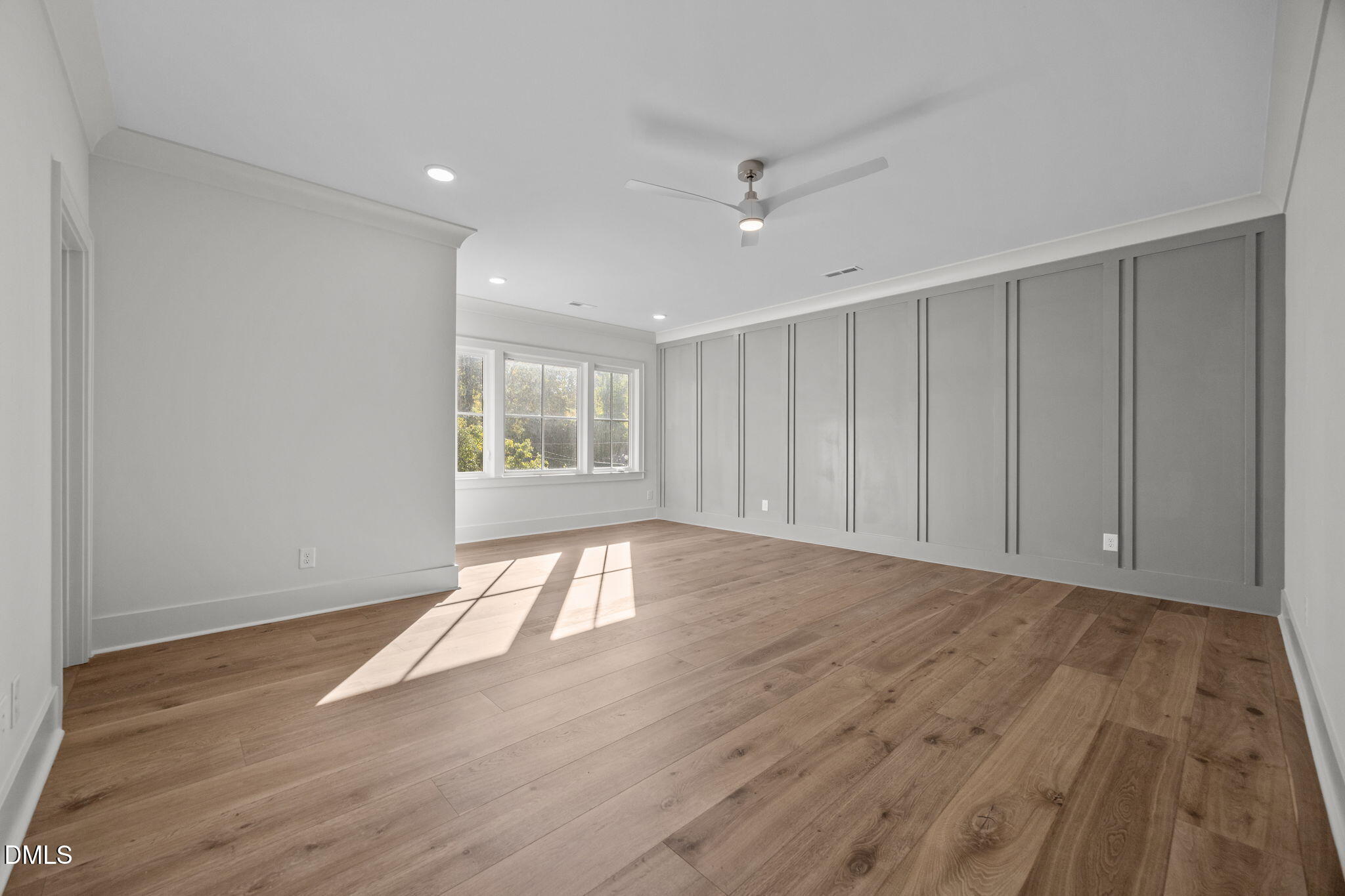 1000 Canterbury Road Raleigh, NC 27607 - Photo 15 of 46 a view of an empty room with wooden floor and a window