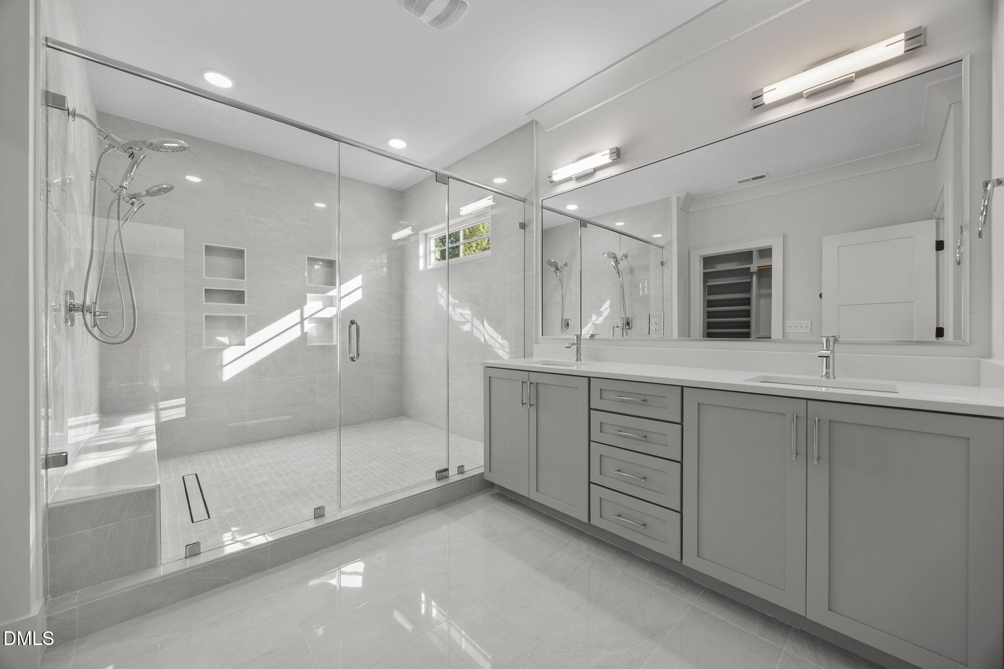 1000 Canterbury Road Raleigh, NC 27607 - Photo 17 of 46 a bathroom with a double vanity sink mirror and shower