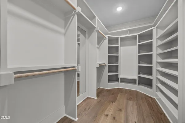 a workspace room with a table and windows
